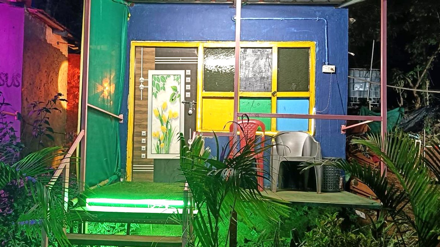 Cottage veranda lit at night